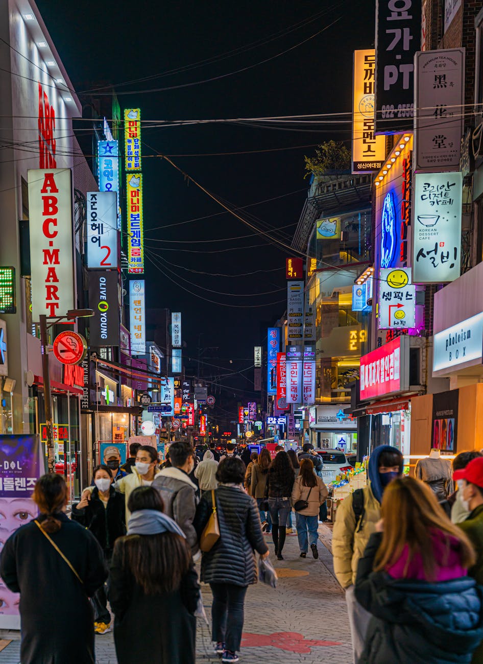 people walking on street at night