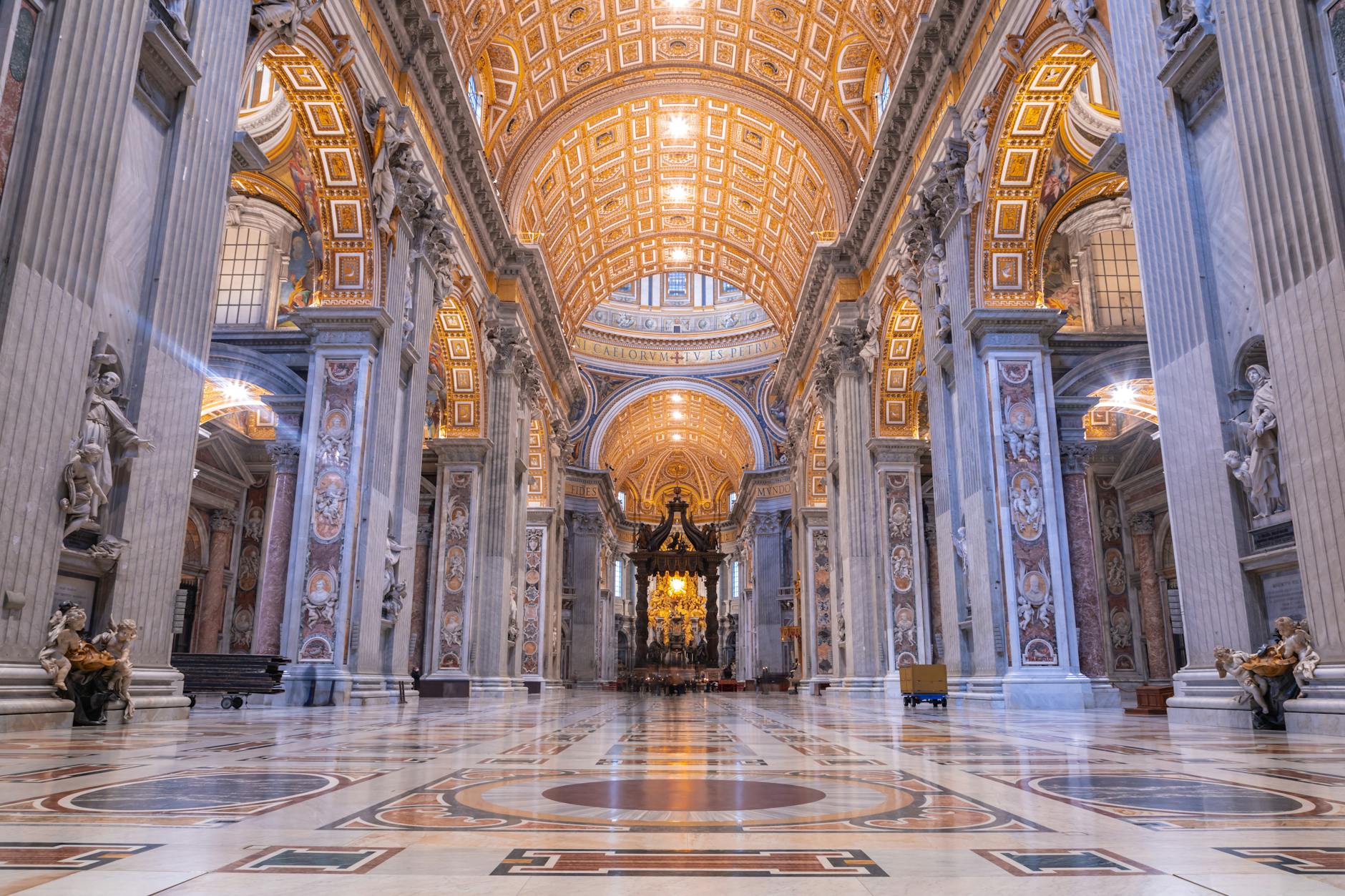 the interior of a cathedral with gold and marble