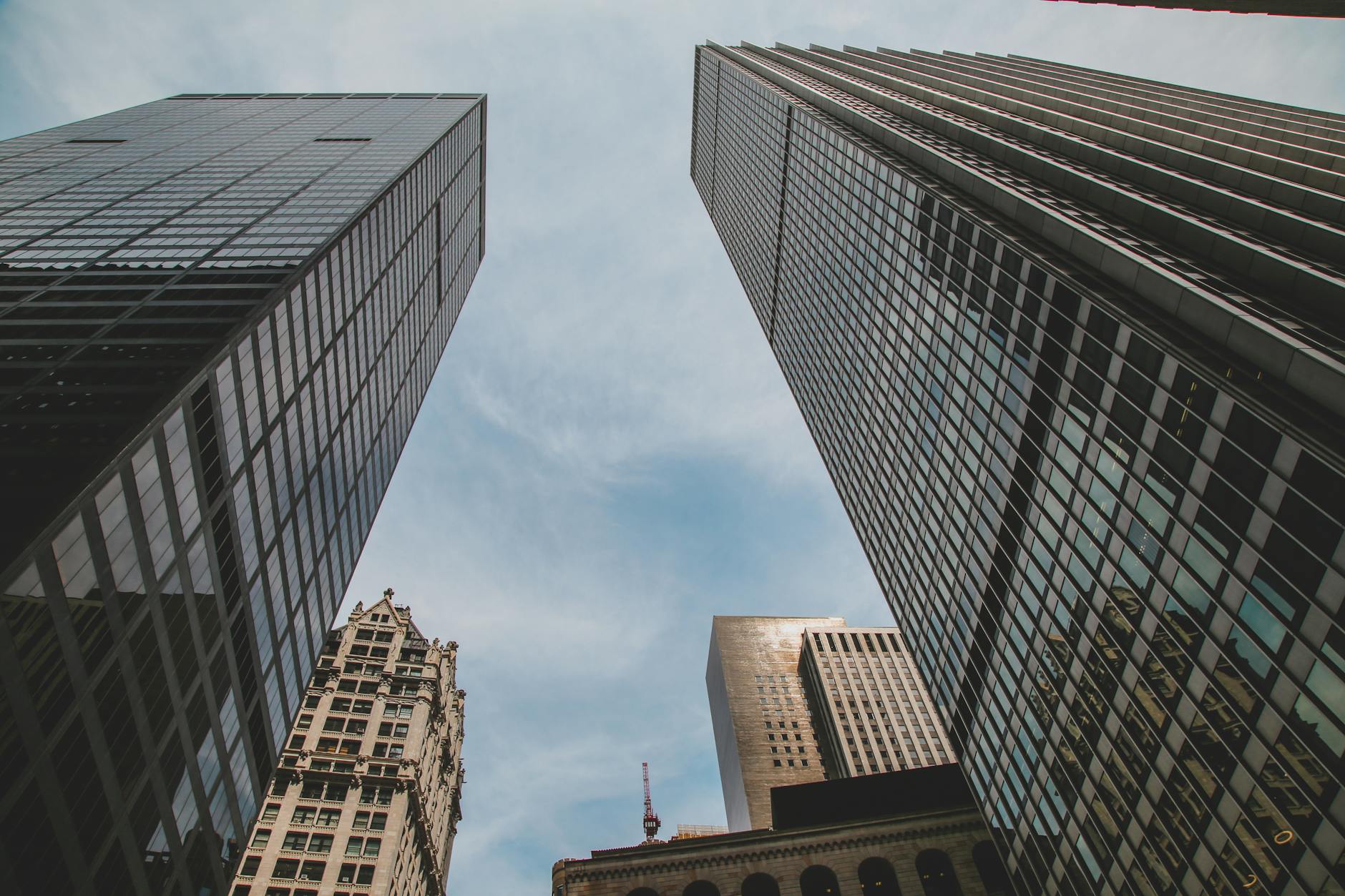 low angle photography of high rise buildings under blue sky