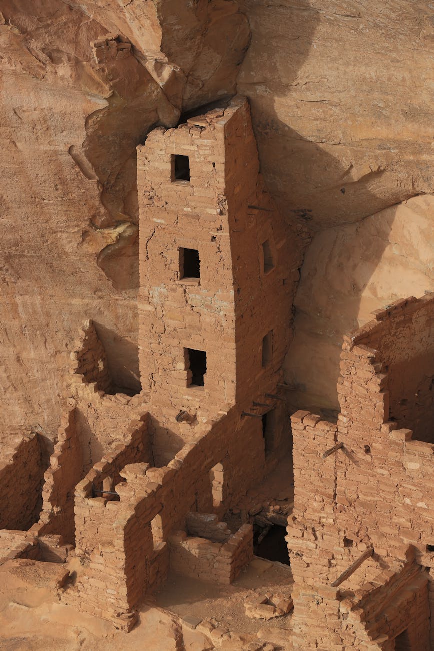 square tower house built into the cliff face in mesa verde national park