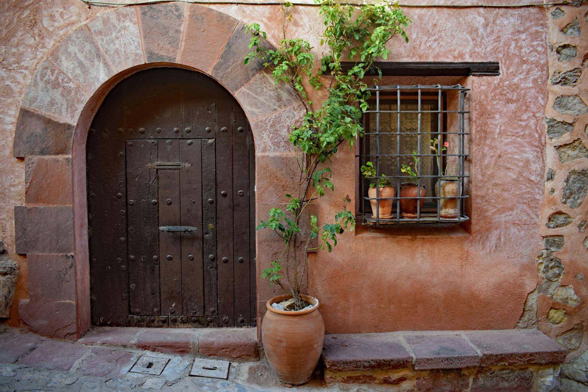 pexels-photo-8306343 a house with a wooden door