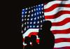 The History of the US Declaration of Independence silhouette of people beside usa flag