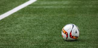 white adidas soccer ball on grass