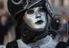 a person in a mask and costume at the venice carnival