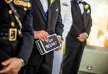 The History of the Bilderberg Group: An In-Depth Exploration man wearing black blazer