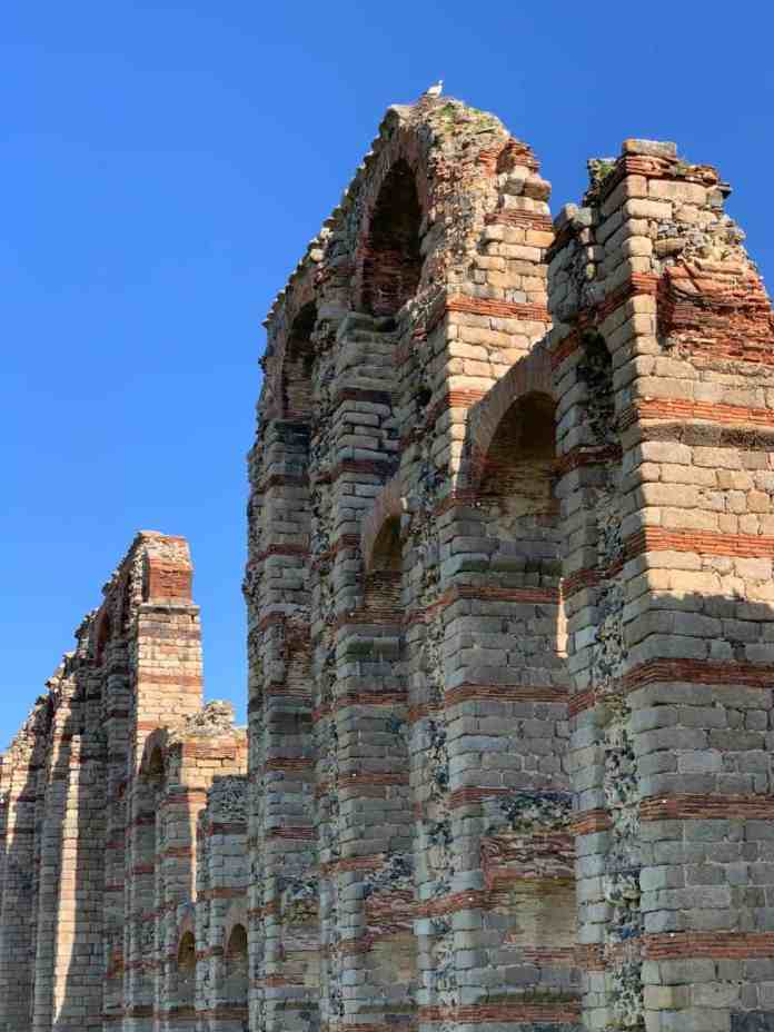 ancient roman aqueduct in merida at daytime