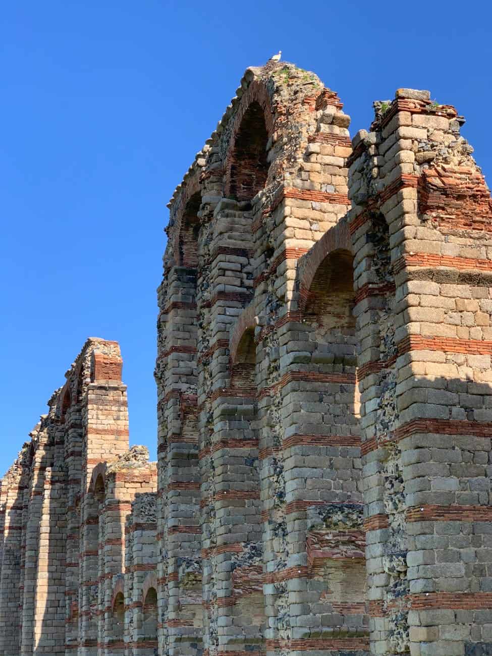 ancient roman aqueduct in merida at daytime