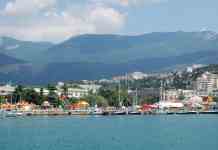 city waterfront near mountains