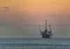 offshore oil rig at sunset in huntington beach