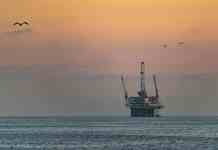 offshore oil rig at sunset in huntington beach