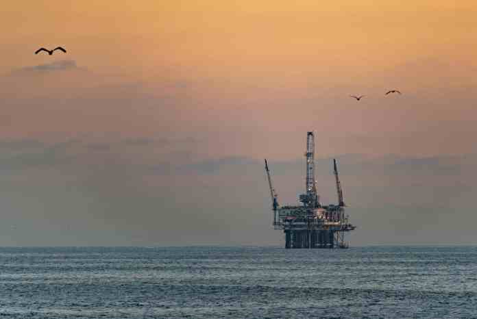 offshore oil rig at sunset in huntington beach
